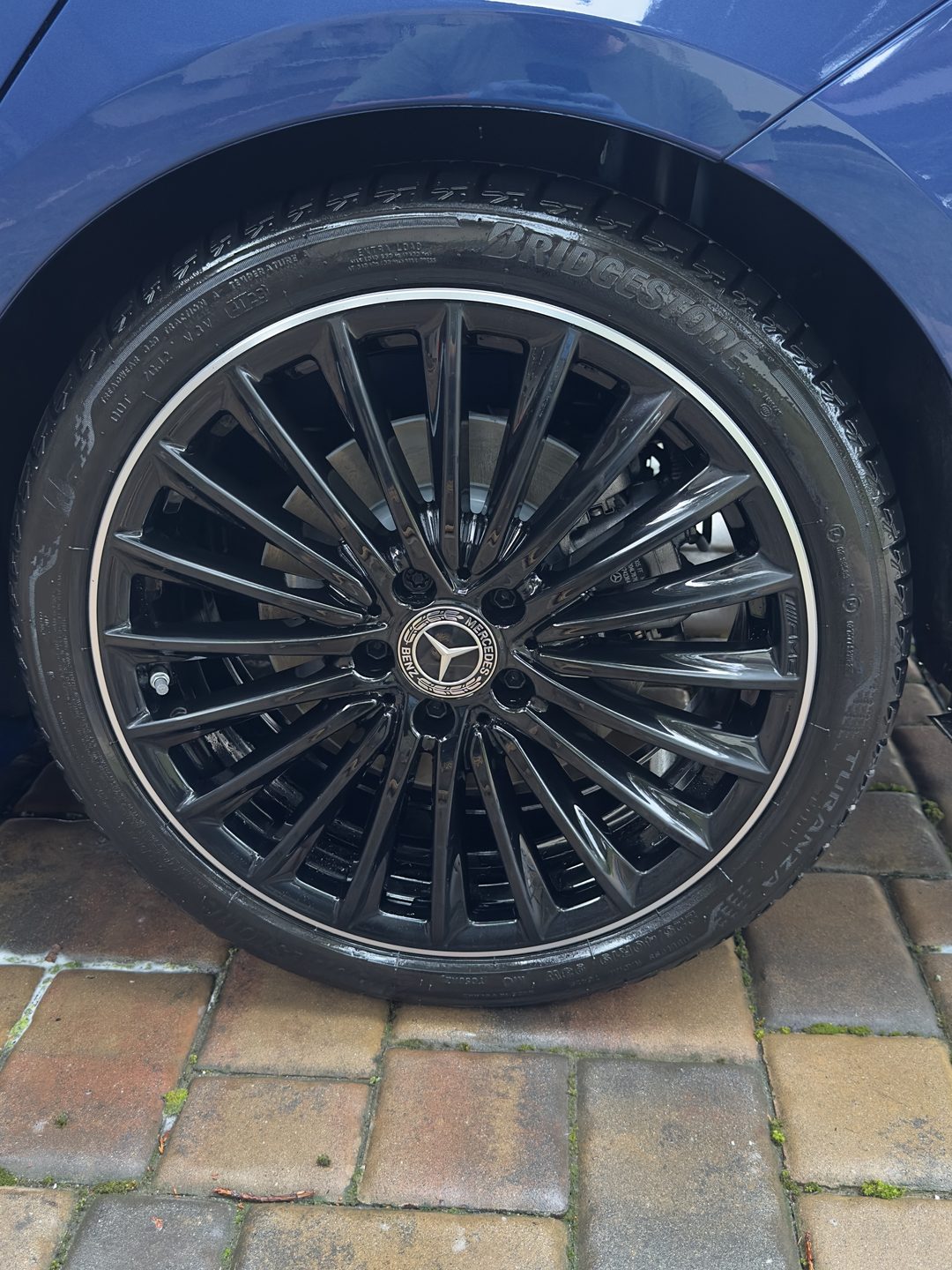 The same Mercedes wheel in flawless gloss black — after detailing by Happy Valley Detailing