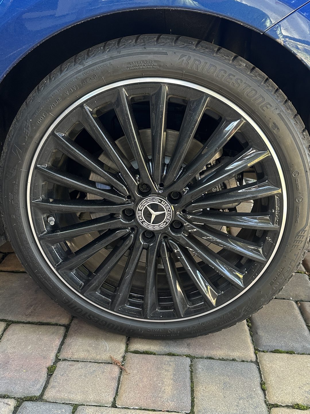 Luxury Mercedes multi-spoke wheel, dulled and scuffed — before detailing